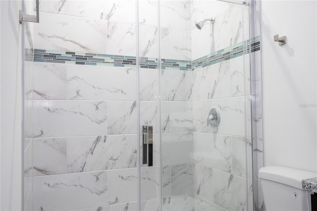 full bath with a shower stall and toilet