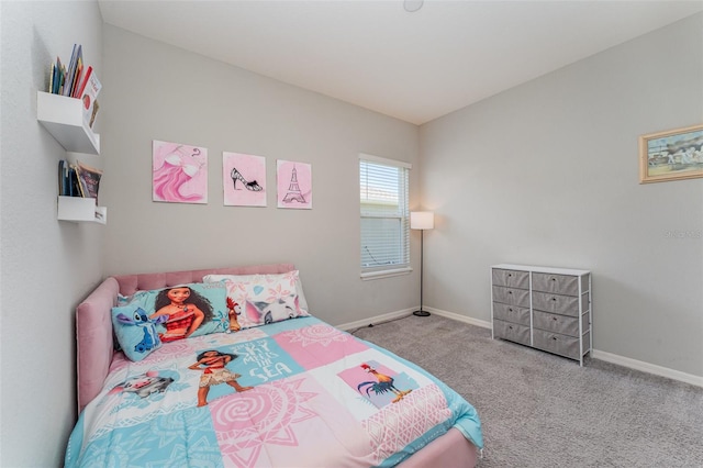 carpeted bedroom featuring baseboards