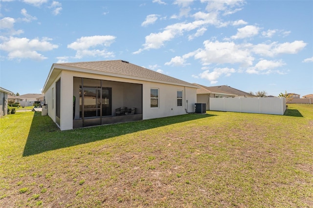 rear view of property with central AC and stucco siding