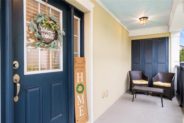 entrance to property with stucco siding