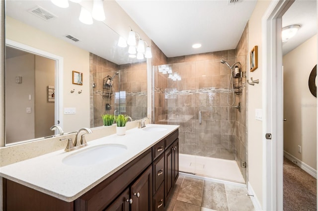 full bath featuring a stall shower, visible vents, and a sink