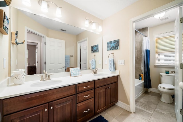 bathroom featuring visible vents, a sink, and shower / bathtub combination with curtain