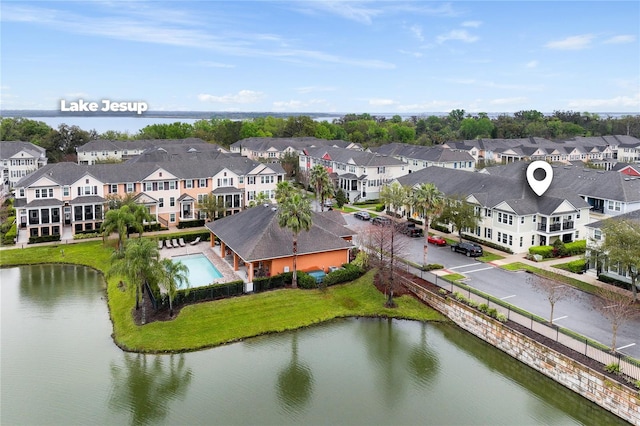 bird's eye view featuring a water view and a residential view