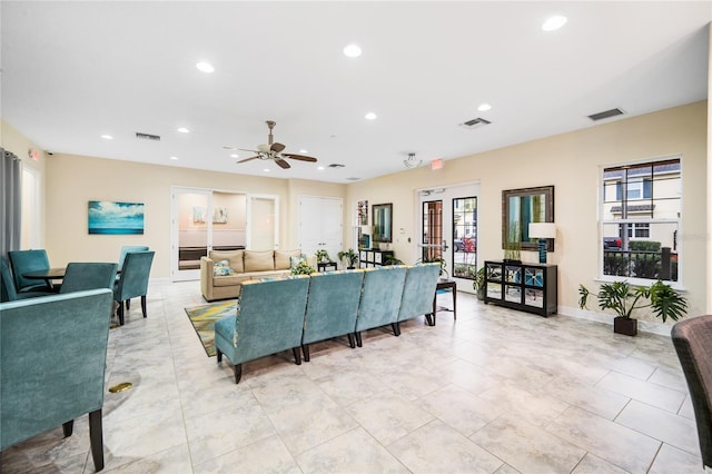 living area with visible vents and recessed lighting