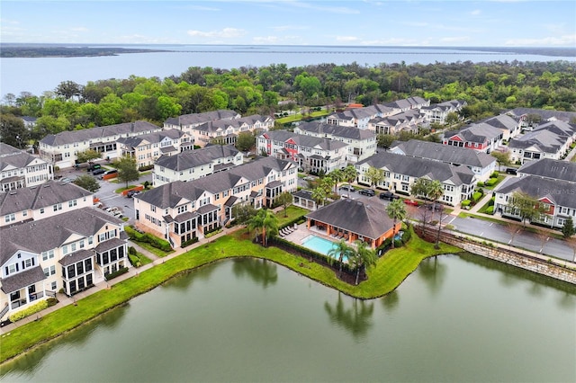 drone / aerial view featuring a water view and a residential view