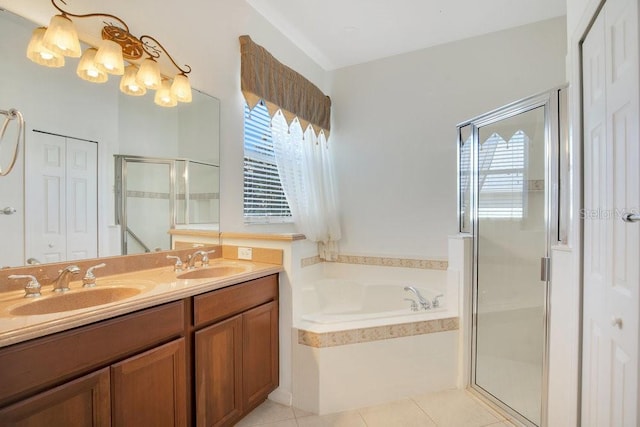 bathroom featuring a wealth of natural light, a closet, and a sink