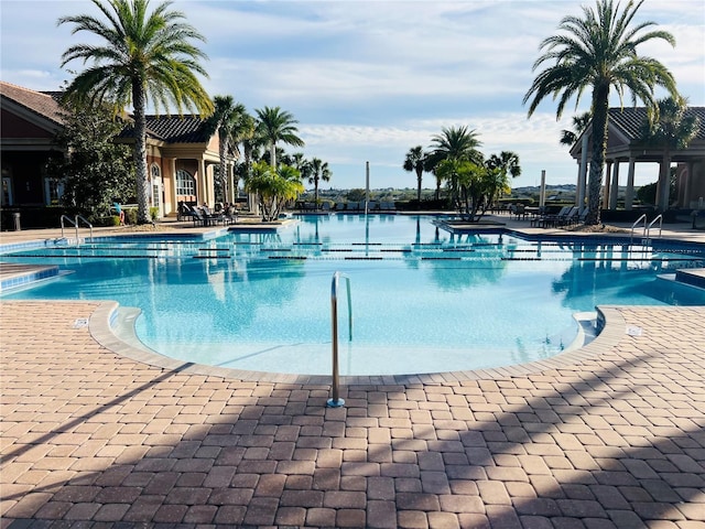 community pool with a patio area