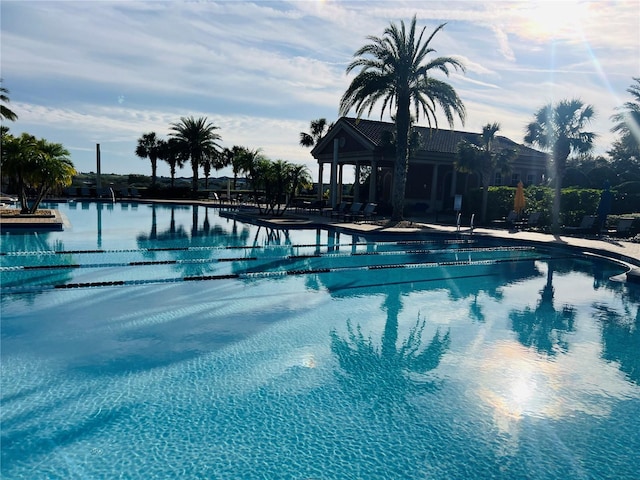 view of pool featuring a water view