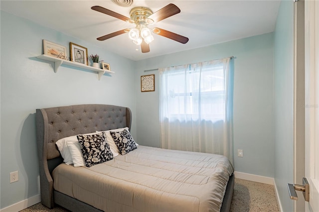 bedroom with ceiling fan, baseboards, and light speckled floor