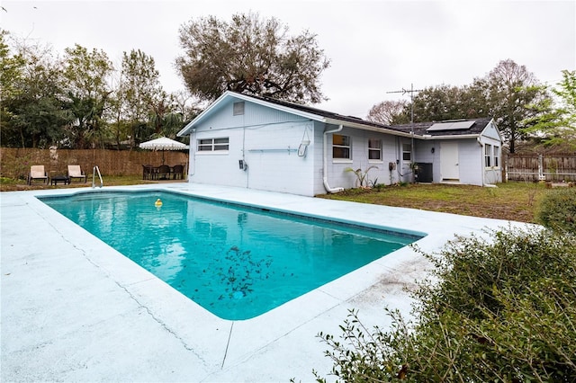 view of swimming pool with a fenced in pool, fence, and a patio