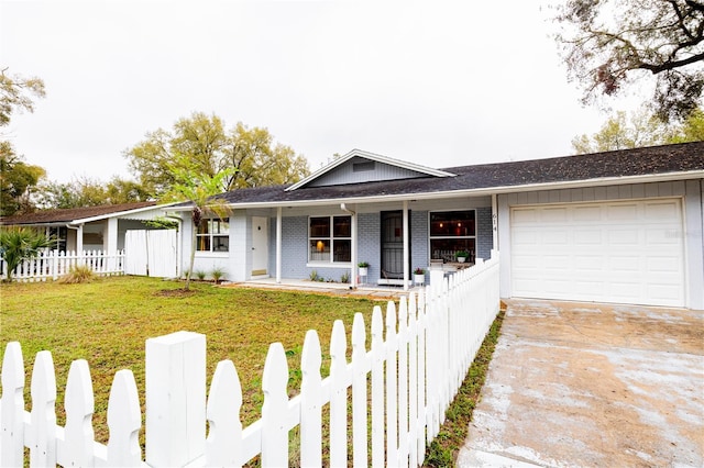 ranch-style house featuring a porch, a fenced front yard, an attached garage, brick siding, and concrete driveway
