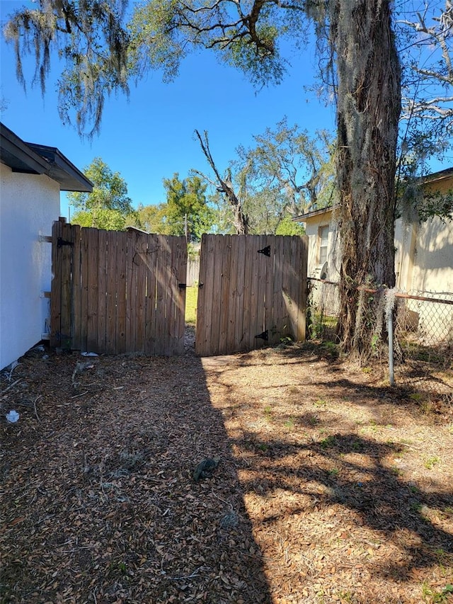 view of yard with a gate and fence