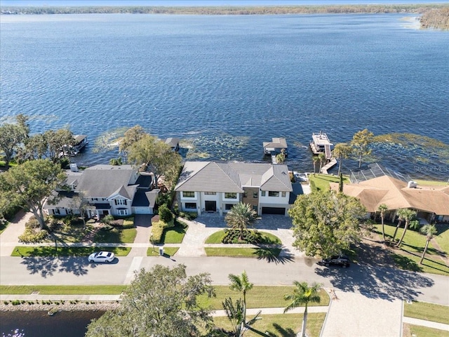 birds eye view of property featuring a residential view and a water view