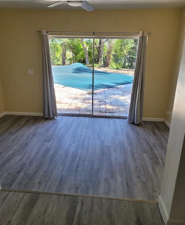 1907 Rockwell Rd, Orlando, FL 32808 - empty room with baseboards, wood finished floors, and a ceiling fan