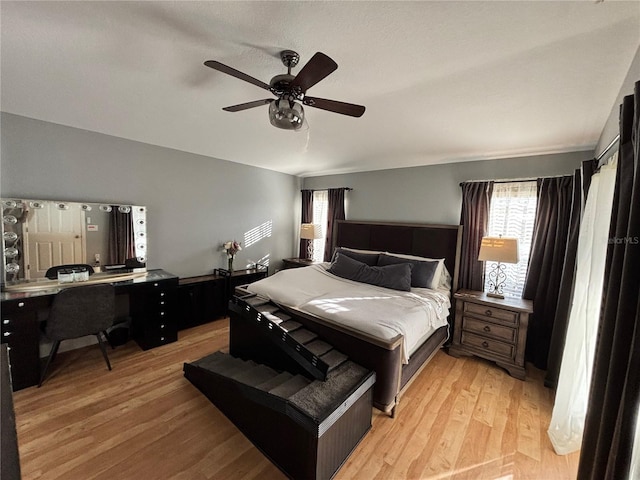 bedroom featuring light wood-type flooring and ceiling fan