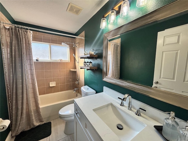 bathroom with toilet, visible vents, shower / bath combo with shower curtain, and vanity