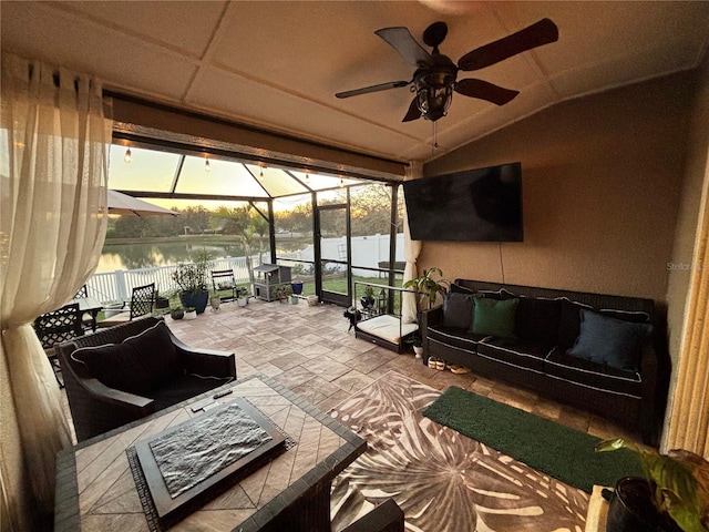 view of patio / terrace featuring an outdoor hangout area, glass enclosure, fence, and a ceiling fan