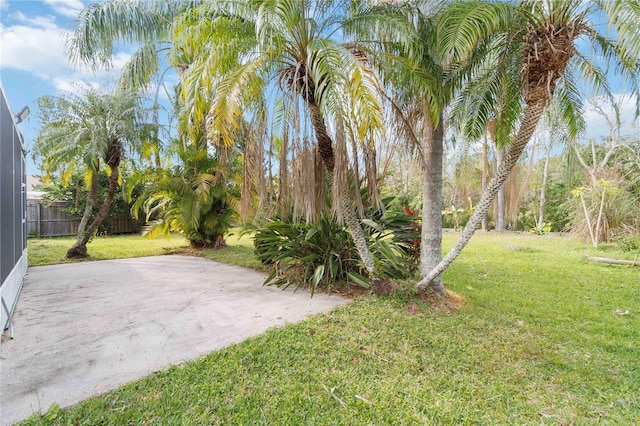 view of yard featuring a patio area and fence