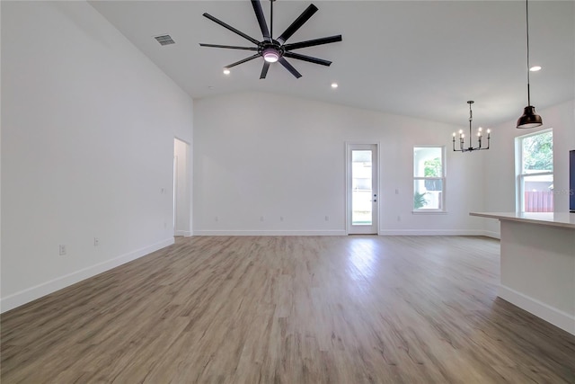 unfurnished room with recessed lighting, ceiling fan with notable chandelier, visible vents, baseboards, and light wood-style floors