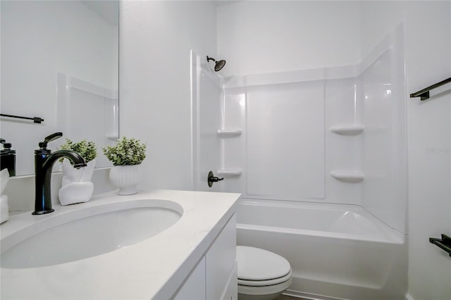 bathroom with vanity, toilet, and shower / bathtub combination