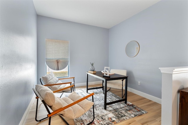 office space featuring light wood finished floors and baseboards