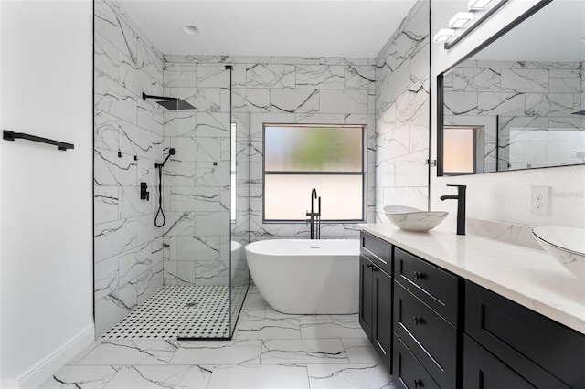 full bathroom with marble finish floor, tile walls, a marble finish shower, a freestanding bath, and vanity