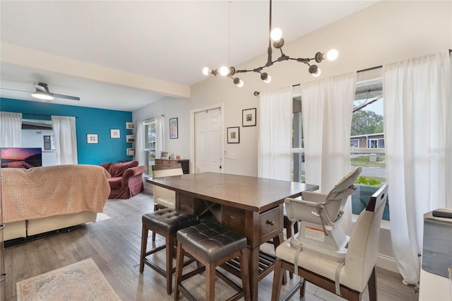 dining room with light wood finished floors, a ceiling fan, and a wealth of natural light