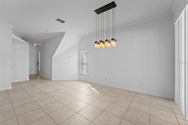 unfurnished room featuring visible vents, crown molding, and baseboards