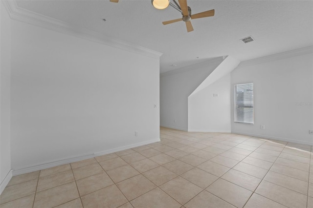 additional living space with visible vents, light tile patterned floors, a ceiling fan, and baseboards