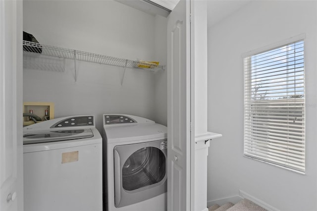 laundry room with laundry area and washer and clothes dryer