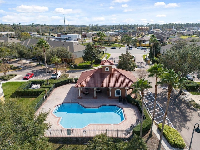 pool featuring a residential view, fence, and a patio