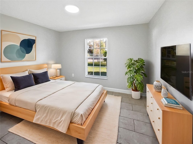 bedroom featuring baseboards