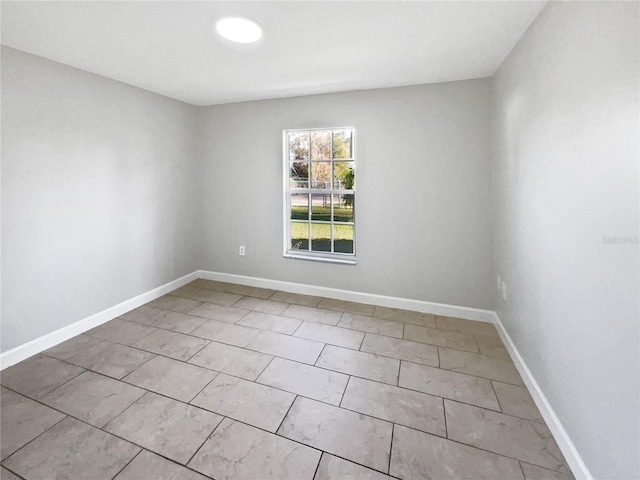 empty room with baseboards