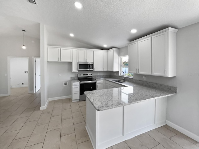 kitchen with stainless steel appliances, a peninsula, a sink, white cabinets, and hanging light fixtures