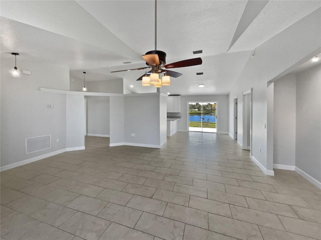 unfurnished room with baseboards, a textured ceiling, visible vents, and a ceiling fan