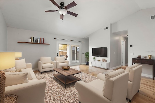 living area with light wood-style flooring, visible vents, ceiling fan, and baseboards