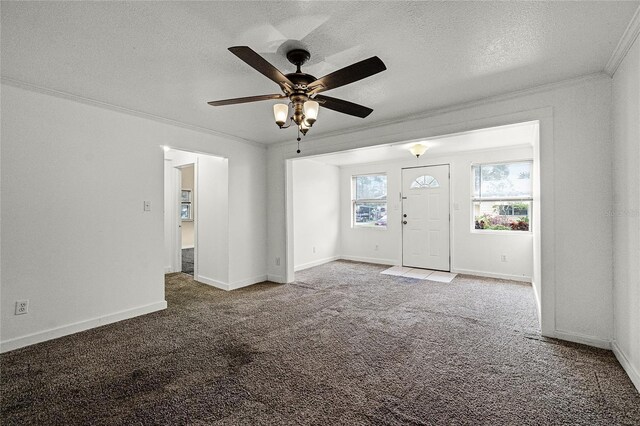 1622 Dolphin Dr, Saint Cloud, FL 34771 - interior space with carpet floors, a textured ceiling, baseboards, and crown molding