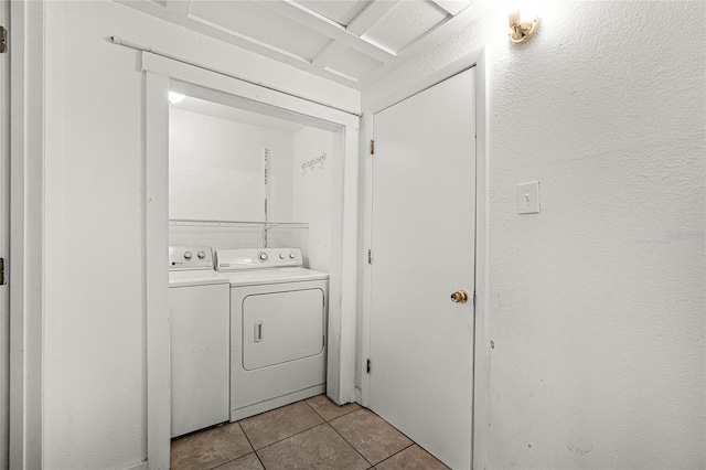 1622 Dolphin Dr, Saint Cloud, FL 34771 - washroom featuring light tile patterned floors, laundry area, and washer and dryer