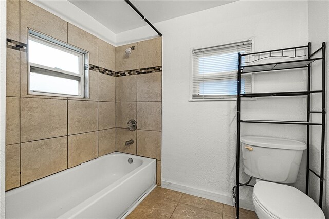 1622 Dolphin Dr, Saint Cloud, FL 34771 - bathroom with shower / bathtub combination, baseboards, toilet, and tile patterned floors