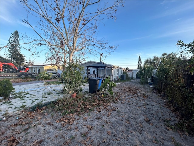 view of yard featuring fence and a gazebo