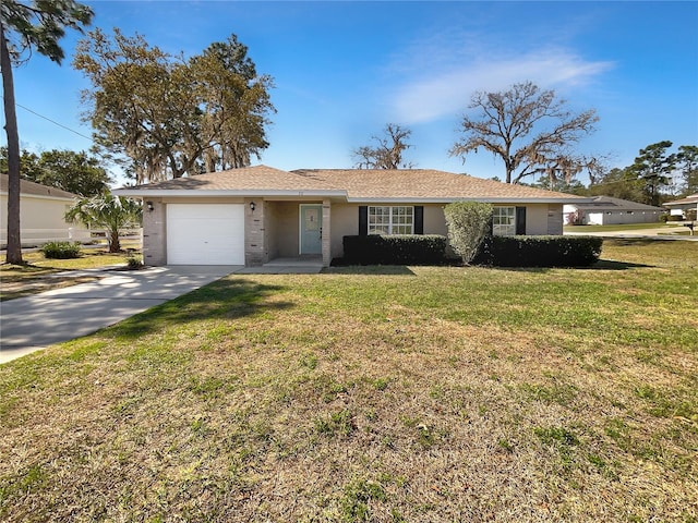 ranch-style home featuring a garage, driveway, and a front lawn