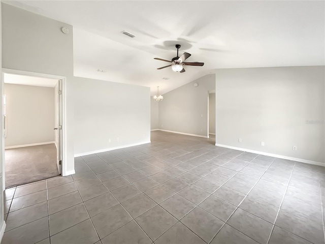 tiled spare room featuring lofted ceiling, visible vents, baseboards, and ceiling fan with notable chandelier