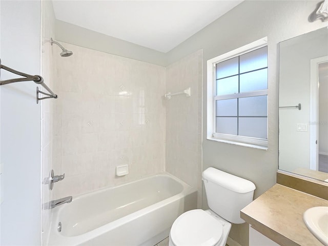 bathroom featuring shower / bathtub combination, toilet, and vanity