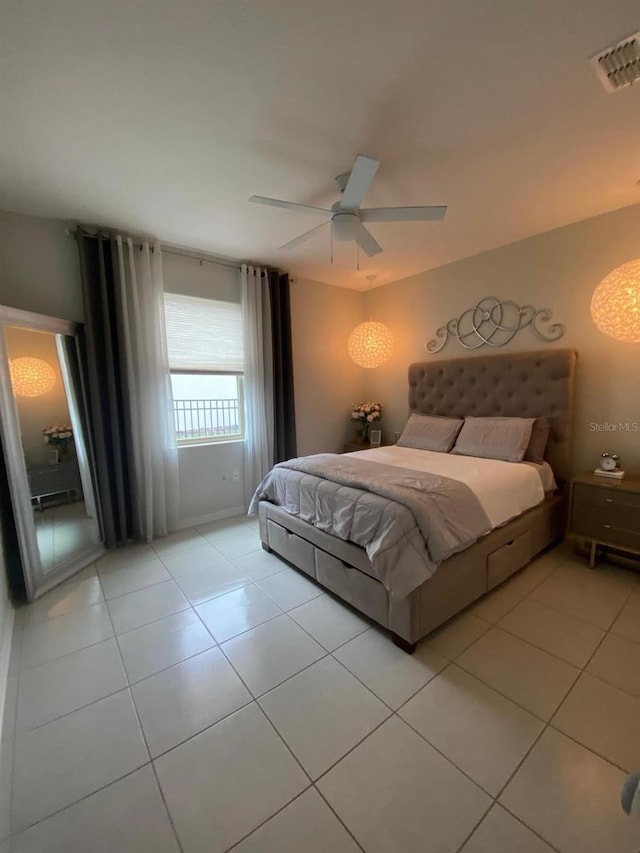 bedroom with visible vents, ceiling fan, and light tile patterned floors