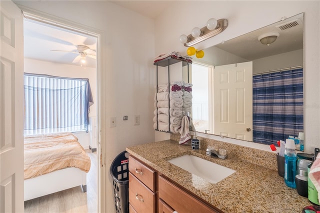 full bathroom featuring ensuite bathroom, ceiling fan, a shower with shower curtain, vanity, and visible vents