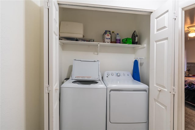 clothes washing area featuring laundry area and washer and dryer