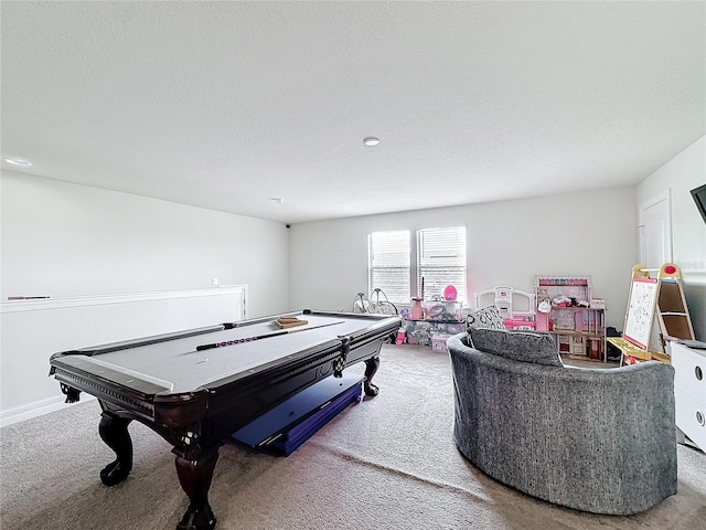 rec room with carpet floors, a textured ceiling, and baseboards