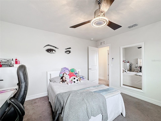 bedroom featuring carpet floors, visible vents, and a ceiling fan