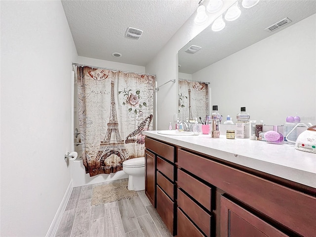 full bathroom featuring toilet, vanity, wood finished floors, and visible vents