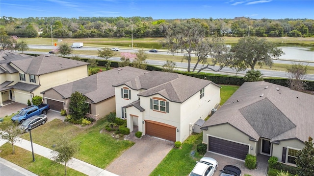 birds eye view of property with a water view and a residential view